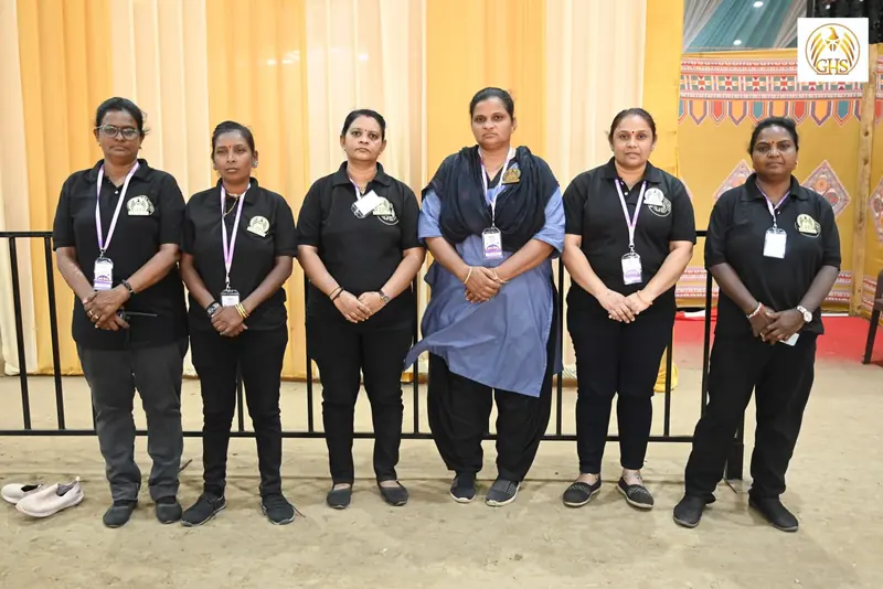 Six women of the GHS team wearing ID cards at an event