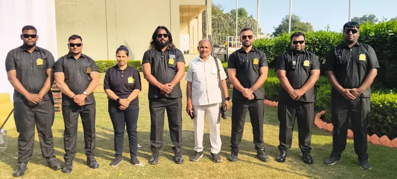 GHS team members standing on a lawn at an outdoor event